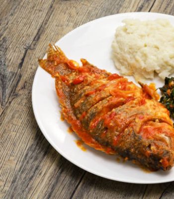 Tilapia stew, ugali(white maize flour mash) and Sukuma Wiki(kale stew), Kenyan food